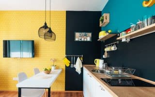 Modern looking black, yellow, blue kitchen