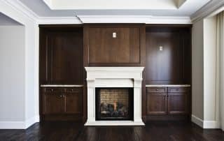 wooden fireplace mantel with white and brown color scheme